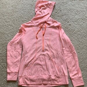 Lightweight women’s pale orange quarter tip hooded sweatshirt.
